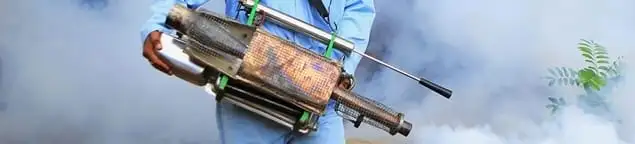 Fumigation technician using a fogger for deep pest treatment in El Paso, TX